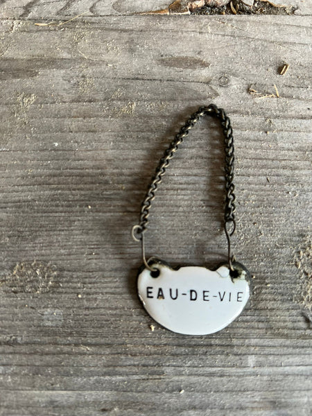 Small Vintage "Eau de Vie" Enamel Tag